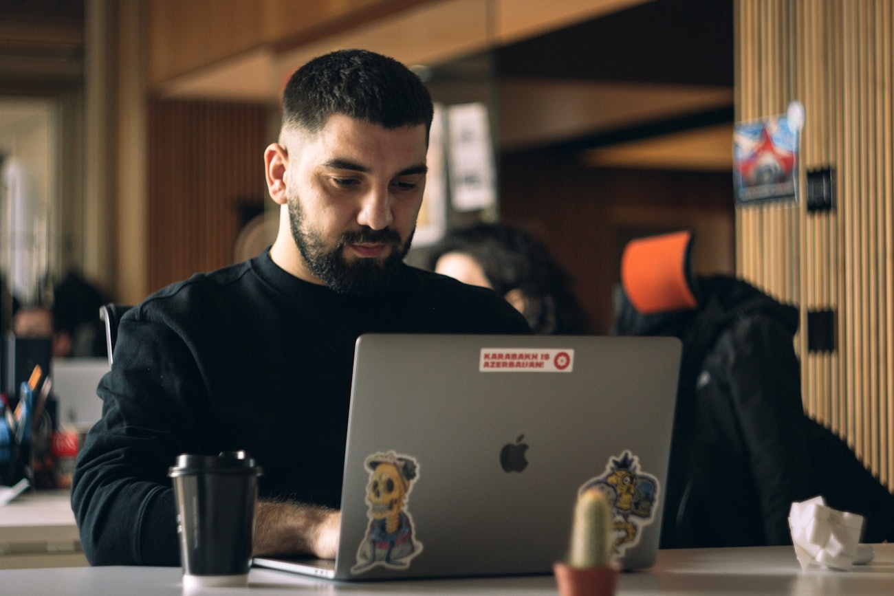 Engineer focused behind laptop