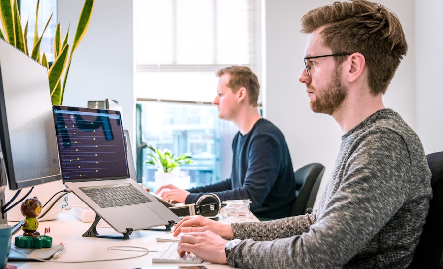 Two engineers behind desk